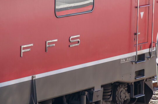 Swiss Federal Railways FFS red locomotive side detail with metal letters in Chiasso, Switzerland