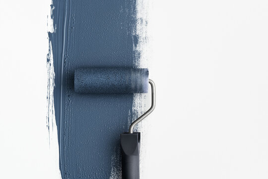 Paint roller leaving a navy blue stroke on clean white background