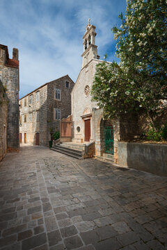 Historic Saint Roch church and stone street in Stari Grad old town