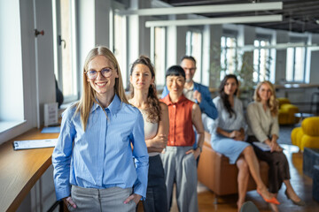 Fototapeta premium Confident business team standing together in modern office