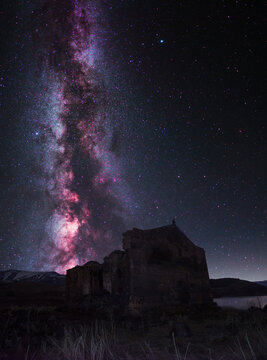 Night landscape, old  Armenian church on the bright Milky Way background.
