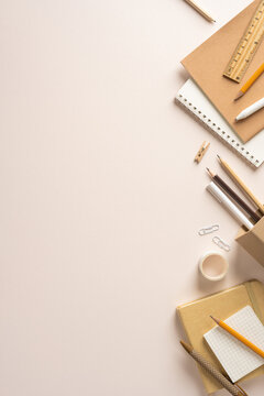Back to school stationery flat lay with notebook pencil ruler and neutral vertical workspace with empty space for creativity