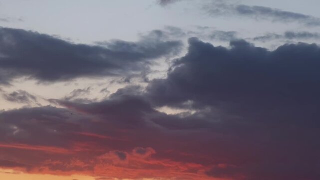 Intense orange stratocumulus clouds in the sky