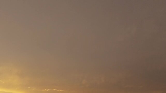 Rare golden stratocumulus clouds at sunset