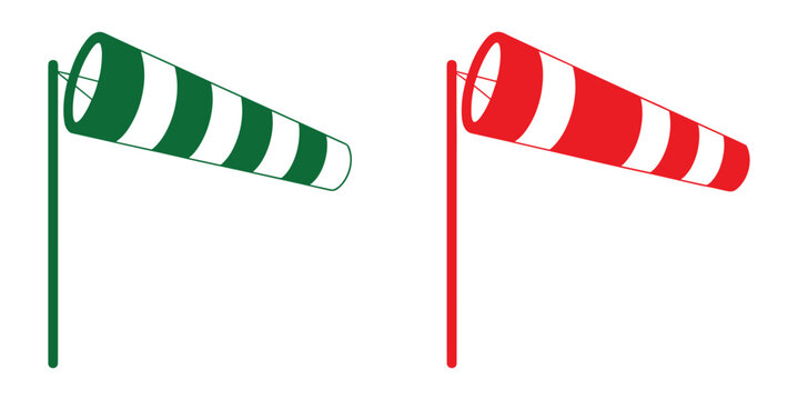 Wind Sock Duo: Two vibrant wind socks, one green and one red, stand tall on poles, their striped fabric billowing in the unseen breeze, indicating wind direction and strength.