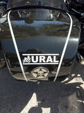 TAVERNES BLANQUES, SPAIN - JUNE 14, 2026.Close up view of a black Ural motorcycle sidecar with white pinstripes and brand logo in a parking area during daylight