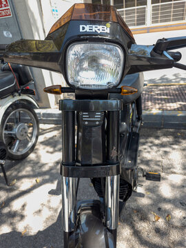 TAVERNES BLANQUES, SPAIN - JUNE 14, 2026.Close up of a vintage black Derbi Variant Start moped with a rectangular headlight and logo in an urban setting
