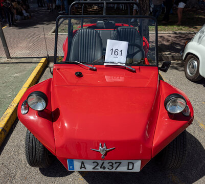 TAVERNES BLANQUES, SPAIN - JUNE 14, 2026.Display of vintage red Jeep CJ off road vehicle in Spain with round headlights and chrome details
