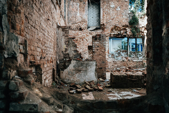Derelict building interior with broken masonry, debris, unsafe walls, and ruined rooms for structural inspection, renovation planning, adaptive reuse and property risk.