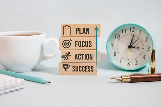 Plan Focus Action Success Concept with Wooden Blocks, Coffee and Office Workspace.