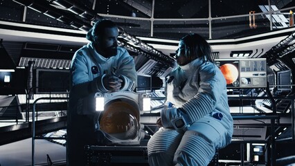 Collaborates cosmonauts chatting, exploring deep space during deep space mission  astronauts perform space exploration mission in spacecraft powered by advanced engineering during mission operations. © DC Studio