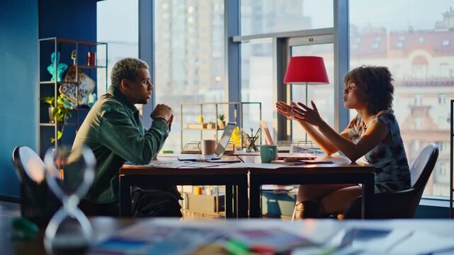 Man woman heated argument office. Colleagues arguing about paperwork at table