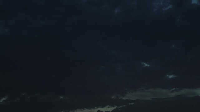 Strange and even gloomy stratocumulus clouds moving at dusk