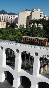 Aqueduct Arch in Lapa, Rio de Janeiro, Brazil. Arcos da Lapa in aerial view, establishing shot.