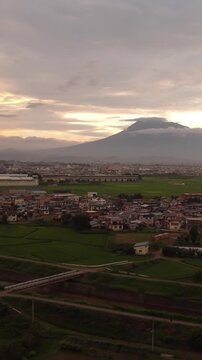 Stunning sunset over Hirosaki city residential area with majestic Mt. Iwaki in the background