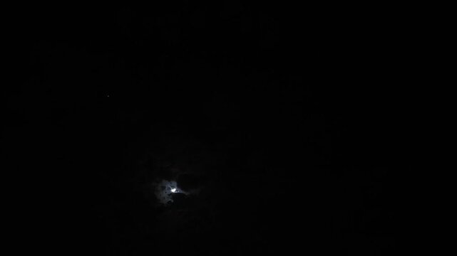 Amazing cresent moon illuminating the clouds