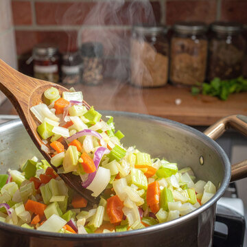 Steaming fresh chopped vegetables stir in a hot pot with a wooden spoon, evoking warmth and cozy home cooking in a rustic kitchen with nobody present. Perfect for culinary concepts.