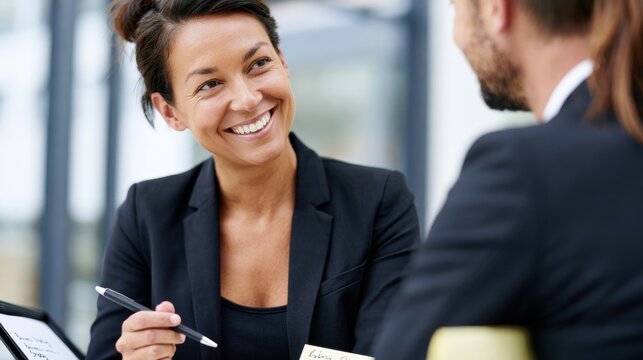 Business consultant discussing strategy with client during professional consultation. Career guidance, business planning, leadership development and personalized advisory services