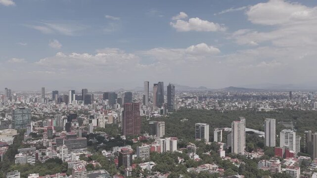 Aerial Panoramic View Flying Backward Over Polanco Toward Paseo de la Reforma Skyline on Sunny Day, Shot in D-Log M
