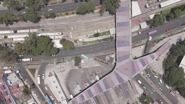 Top-Down Aerial View of CETRAM Huipulco Transit Hub with Vehicular and Pedestrian Flow, Calzada de Tlalpan, Mexico City, Shot in D-Log M
