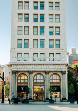 Newark, NJ - US - Jul 26, 2026 Historic National State Bank building in Newark featuring a grand stone facade, arched windows, and classical columns along a sunlit downtown street.
