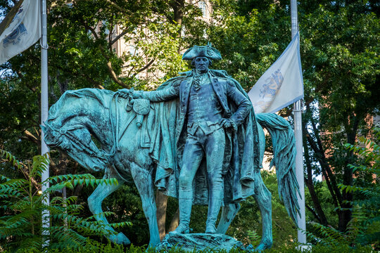 Newark, NJ - US - Jul 26, 2026 Majestic bronze equestrian statue by J. Massey Rhind in Harriet Tubman Square depicts General Washington in military uniform, standing by his lowered horse.