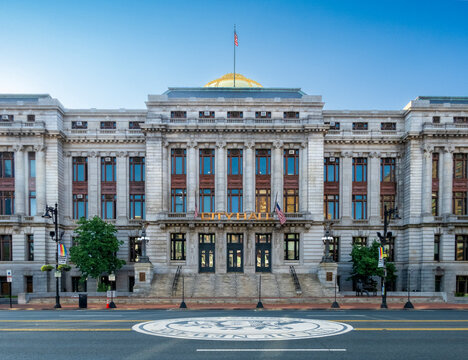 Newark, NJ - US - Jul 26, 2026 Symmetrical view of Newark City Hall with its neoclassical facade, columns, and golden dome, captured in morning light with empty street foreground and civic seal.