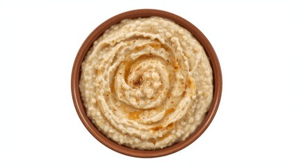 Fototapeta premium Close-up, top view of oatmeal in a circular brown dish on a white background.