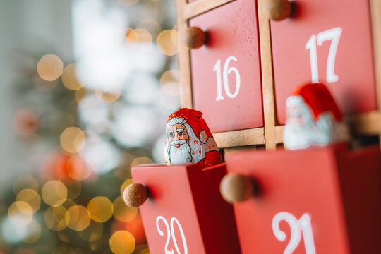 Wooden Christmas Advent Calendar with Chocolate Santa.cozy holiday atmosphere for Advent countdown,Christmas traditions,family celebrations,holiday promotions, seasonal blog