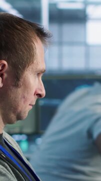 IT team addresses technical problem during data center work, combining bug fixing, support escalation and technical pressure from camera A angle.