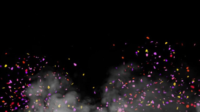 Confetti bursts upward into the air against a deep black background while thick white smoke billows from the base to create a dynamic and energetic atmosphere for parties and grand celebrations.