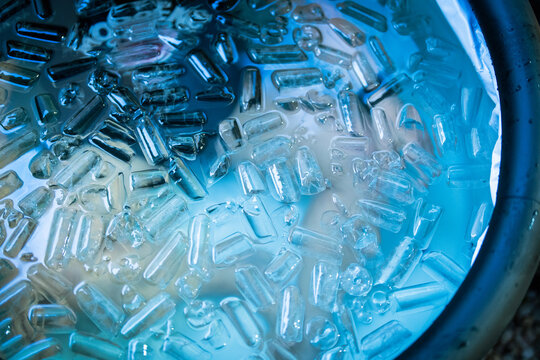 Athlete submerged in an ice bath filled with floating ice cubes during a cold plunge session to support muscle recovery, reduce inflammation, and improve athletic performance. Ideal for wellness and b