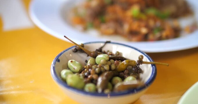 Close up of Northern Thai pickled local herbs and side dish