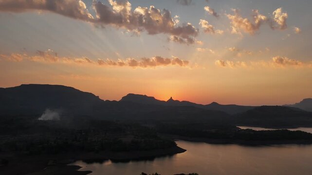 Sunset over Bhandardara lake and Sahyadri mountains India aerial