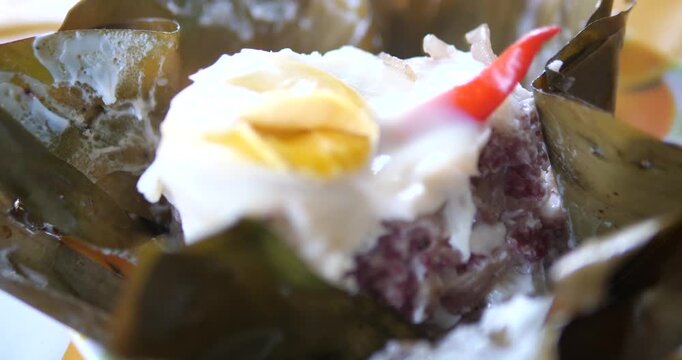 Close up of Northern Thai grilled sour pork with egg Naem Mok Khai