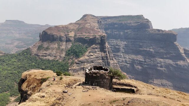 Ratangad fort bastion ruin and Sahyadri cliffs Maharashtra India