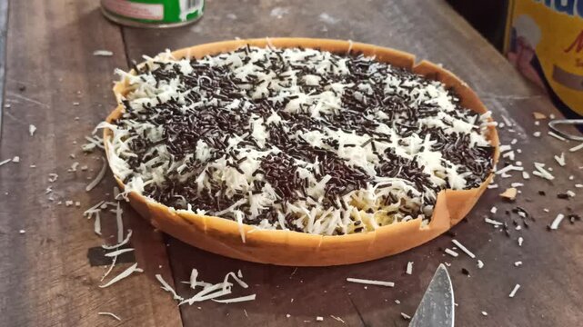 A delicious Indonesian sweet martabak freshly prepared with a soft texture and rich filling, showcasing one of the most popular traditional street food desserts in Indonesia.