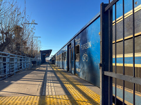 Pilar Station, empty southbound platform and cargo train carriage - Buenos Aires Argentina