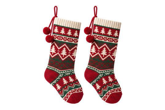 Two knitted Christmas stockings with winter patterns and pompoms