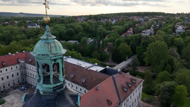 Close drone orbit keeps tower framed while revealing lower palace structure