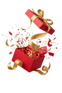 Exploding red gift box with gold ribbon and confetti