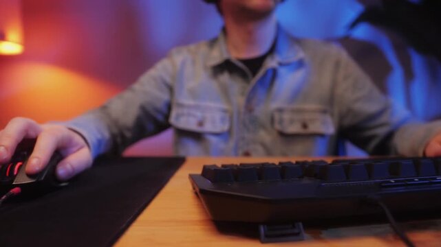 Gamer Hands Using Backlit Keyboard and Mouse During Live Stream
