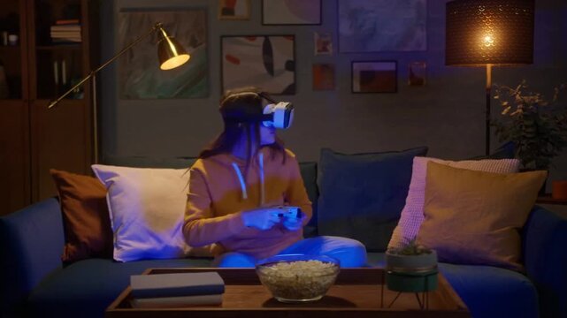 Excited Woman Playing Video Games with Headset and Controller at Home