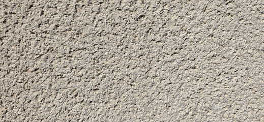 Rough grey concrete wall texture background creating abstract pattern © FlorianSchultze