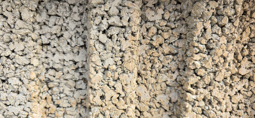 Rough textured concrete wall showing abstract surface pattern © FlorianSchultze