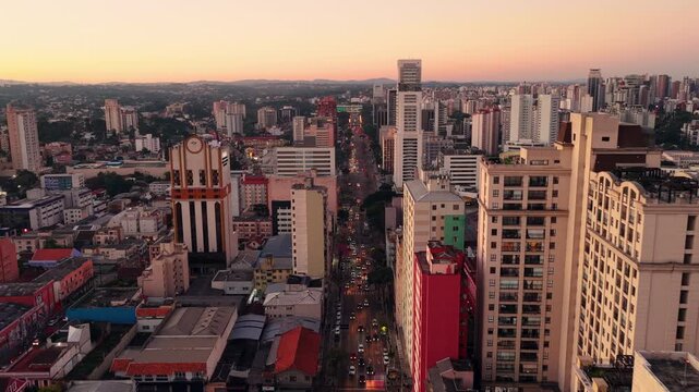 Sun setting over the vibrant urban skyline of Curitiba Parana, Parana, Brazil