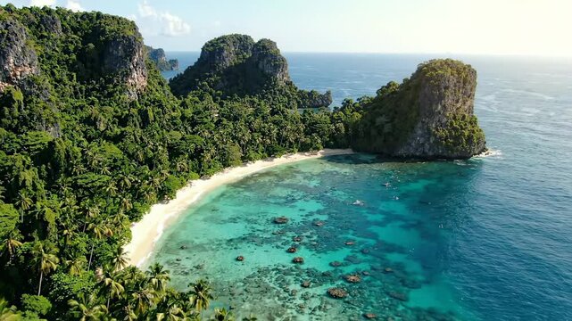 Aerial view of tropical island beach and limestone cliffs