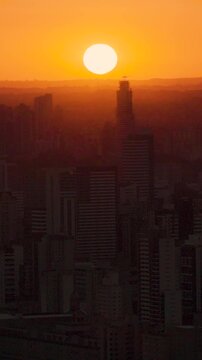 Urban cityscape of Curitiba Parana bathed in sunset colors, Parana, Brazil