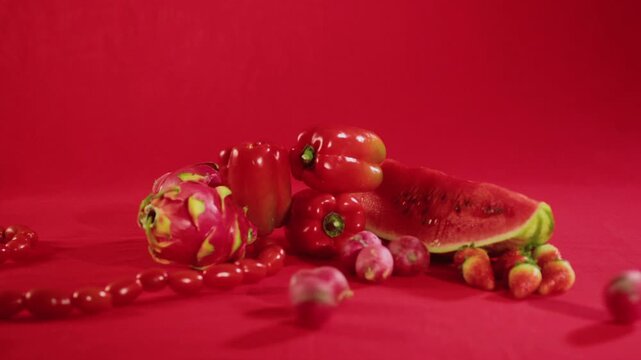 A captivating agricultural still life cinemagraph featuring fresh farm produce arranged in a rustic setting with subtle, seamless motion. Gentle movements such as swaying leaves, d
