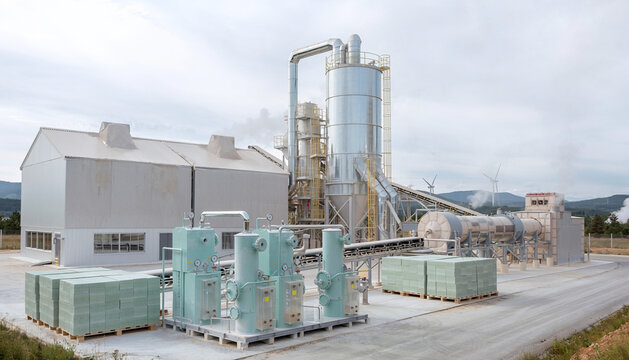 Industrial Facility with Silos and Machinery in a Rural Setting
